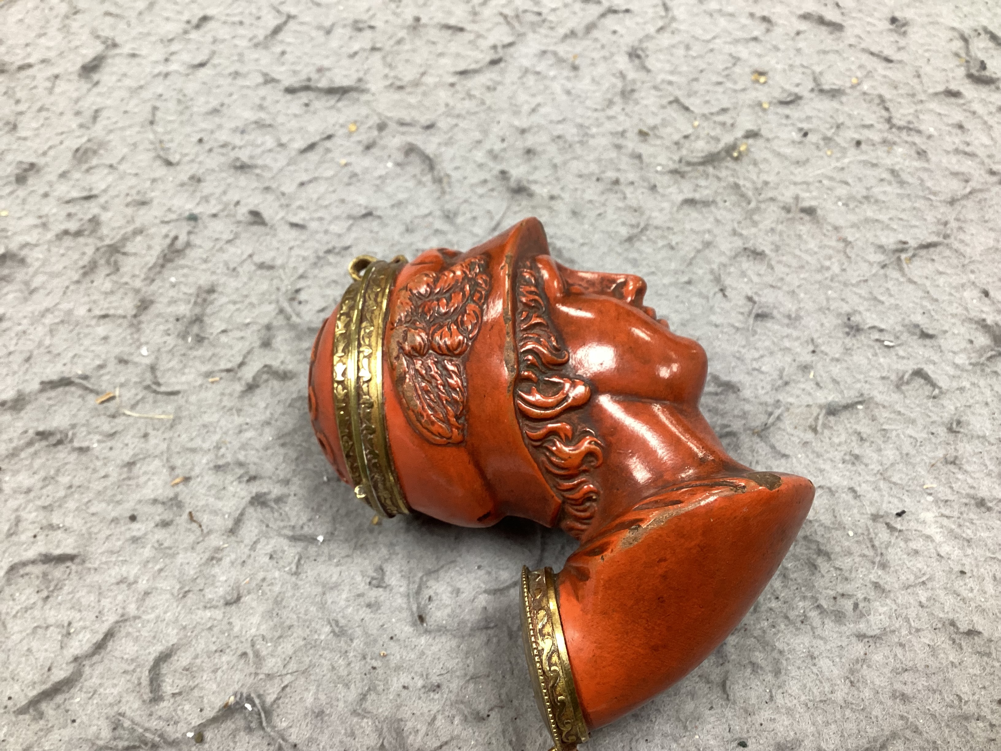 A 19th-century French terracotta pipe modelled as the bust of Hermes, approximately 10cm high